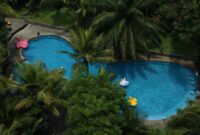 Suasana pemandangan hijau dataran tinggi Batu Malang yang menyajikan udara sejuk dan kenyamanan ruang terbuka bagi aktivitas liburan keluarga lintas generasi.